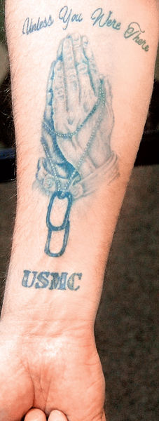 and a Marine Corps tattoo